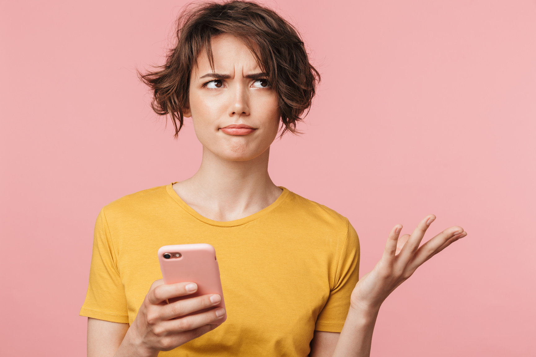 Confused Woman Using Smartphone